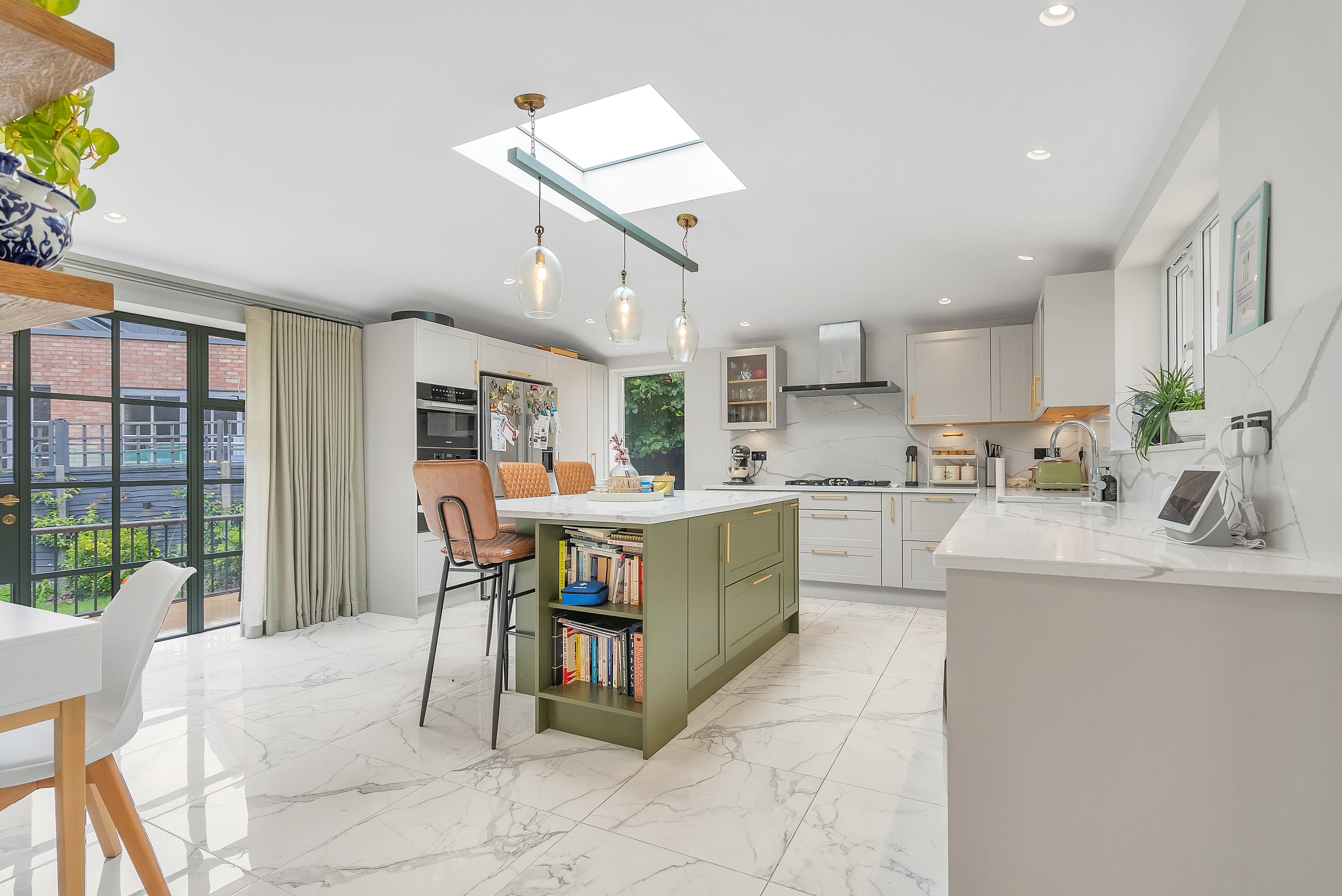 Kitchen opening to Crittall doors and garden