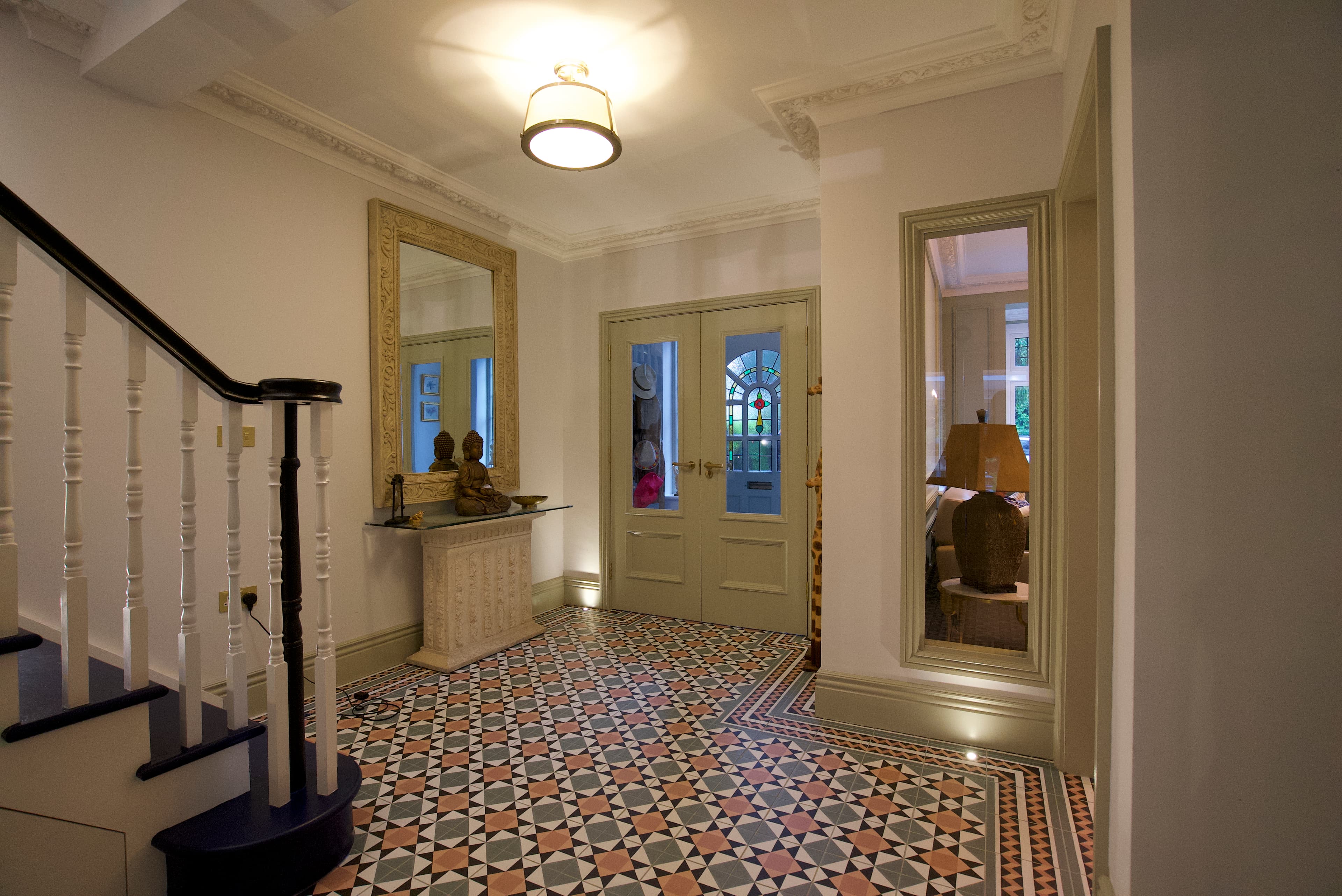 Victorian geometric entrance tiles with period staircase