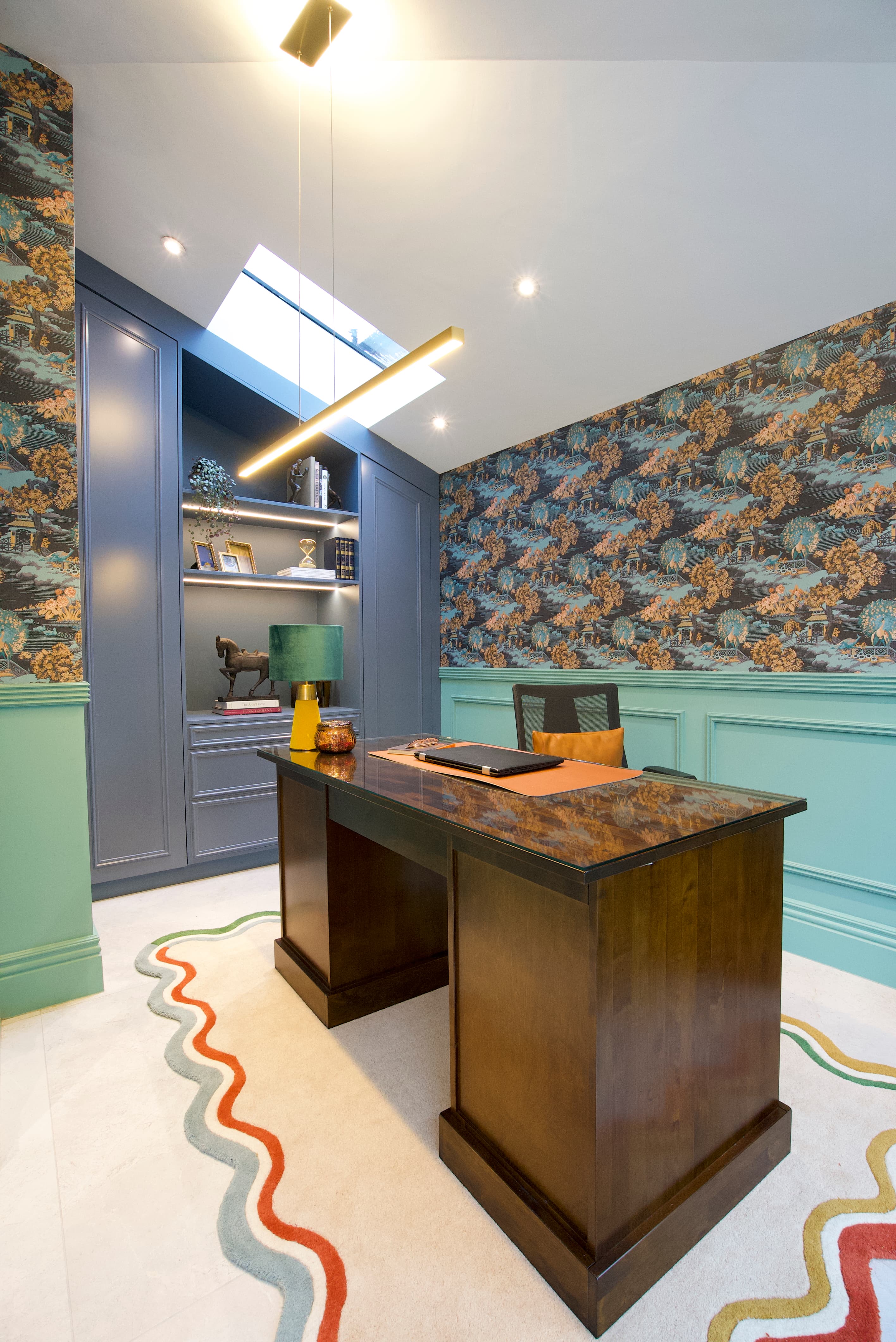 Home office with chinoiserie wallpaper and mint panelling