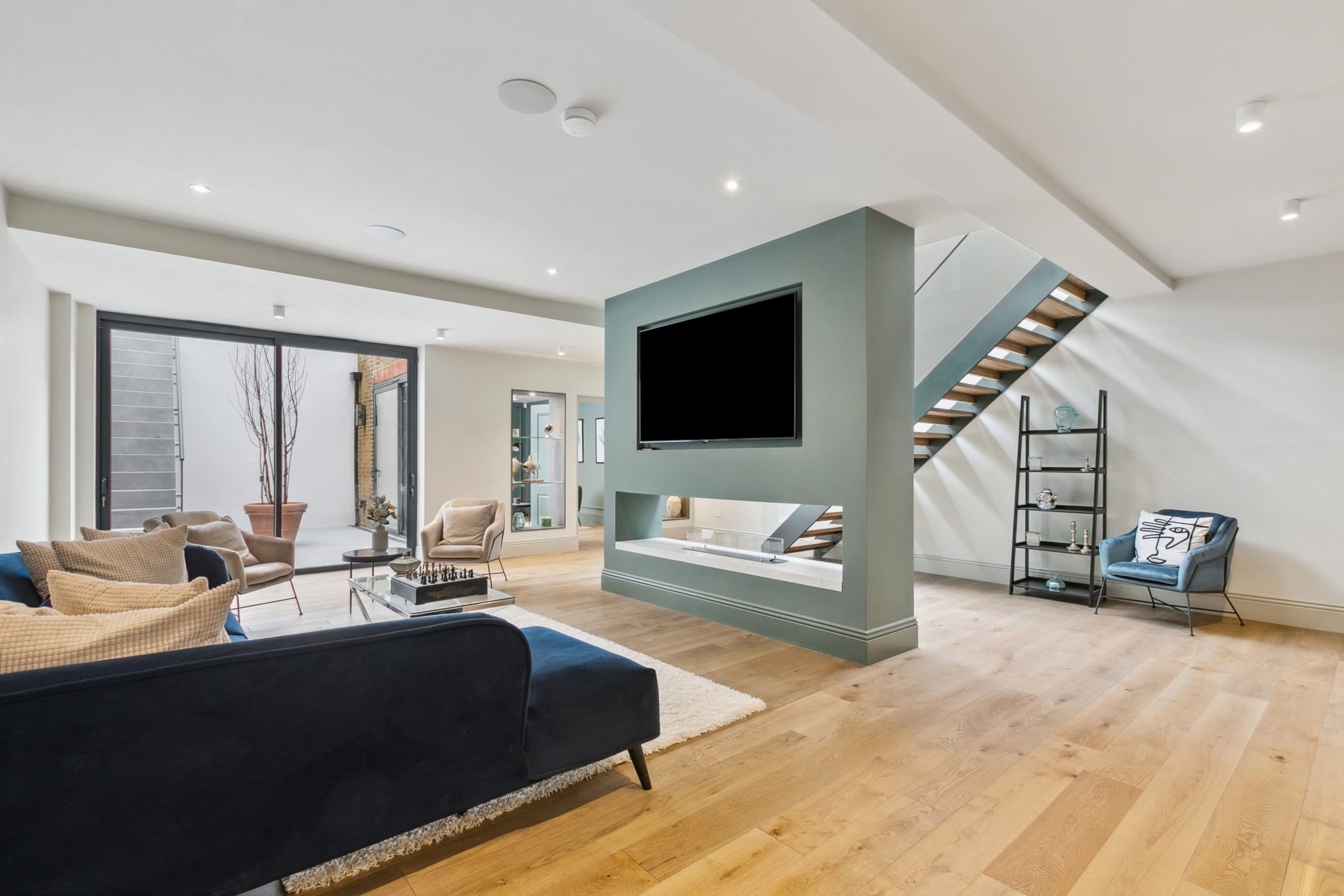 Basement living space with floating staircase