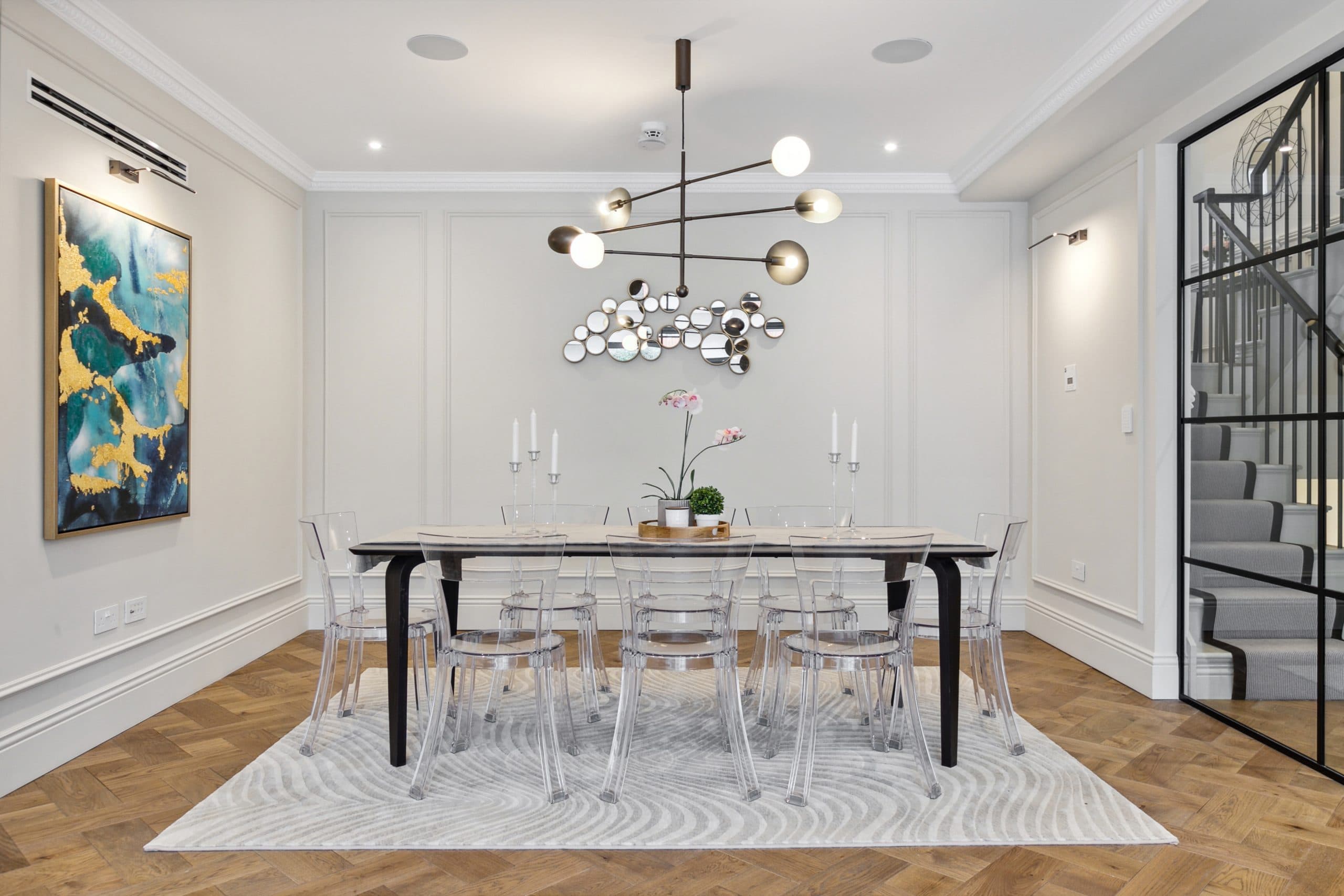 Formal dining room with sculptural brass chandelier