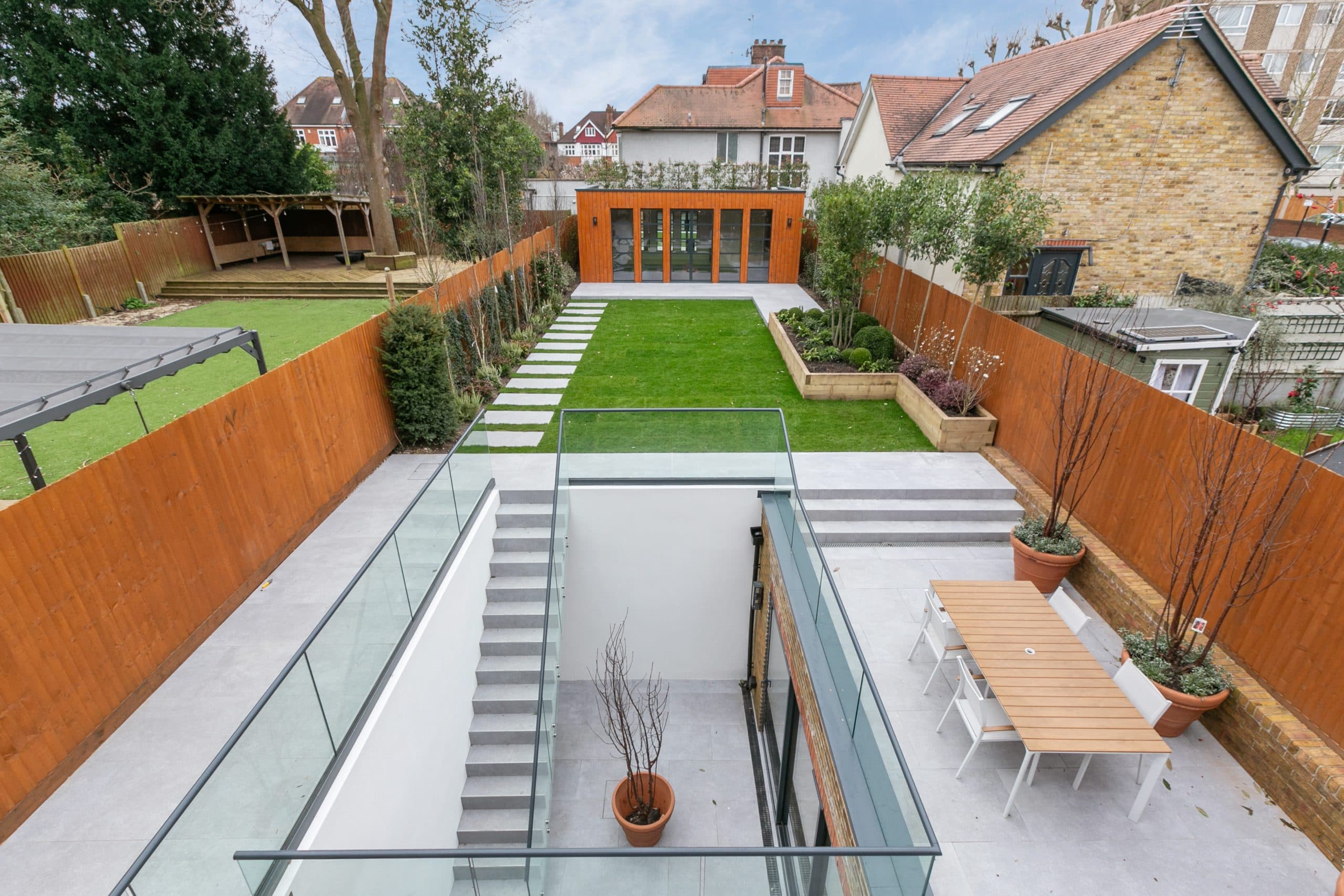 Landscaped garden with modern outbuilding