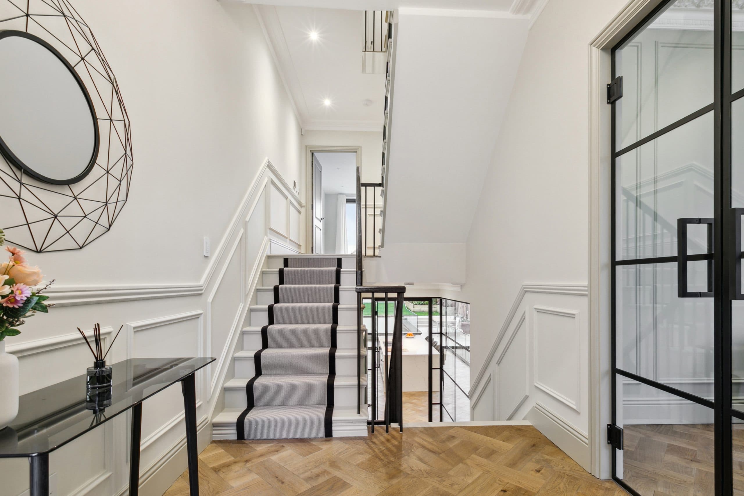 Period staircase with runner and Crittall doors