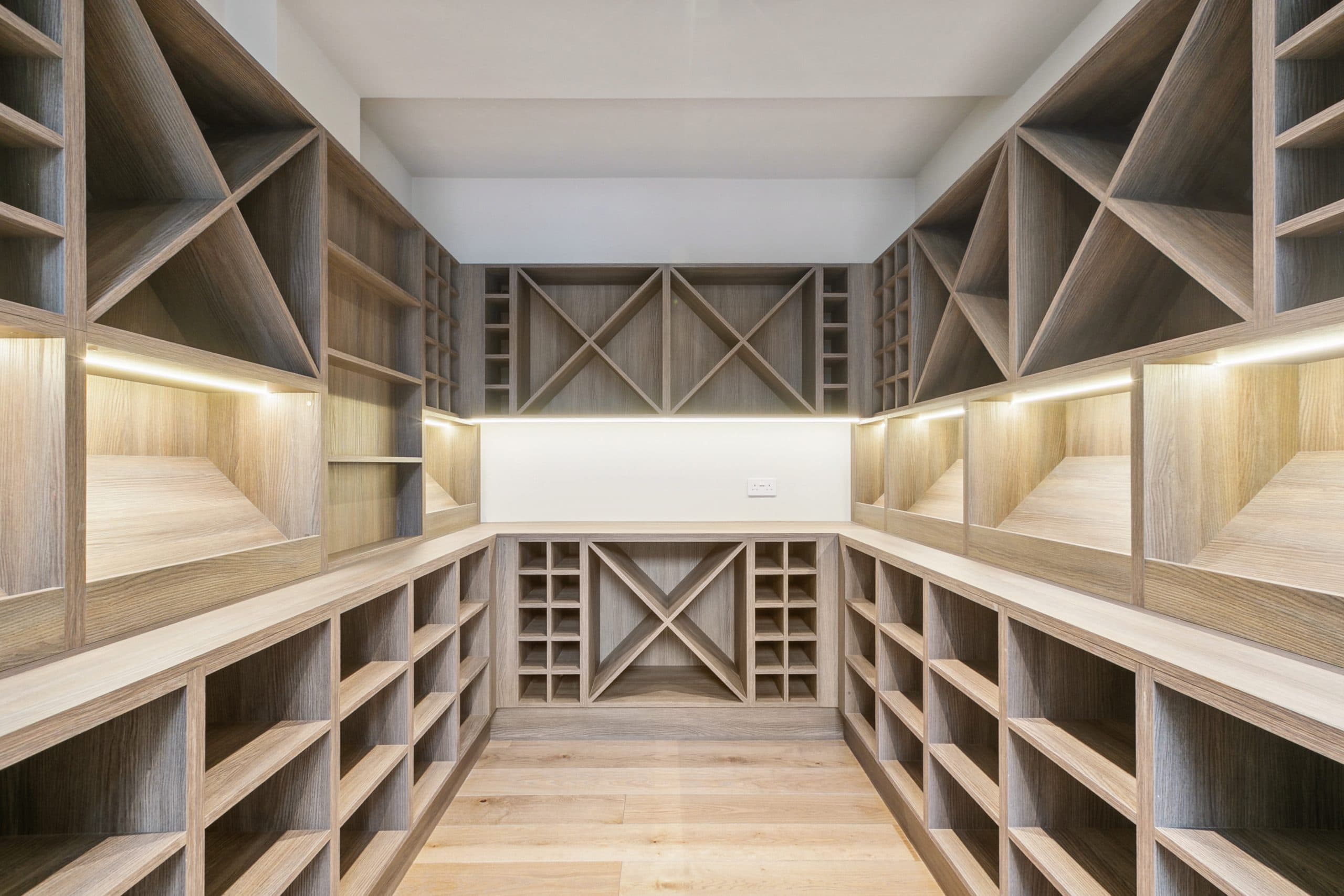 Bespoke oak wine cellar with integrated lighting