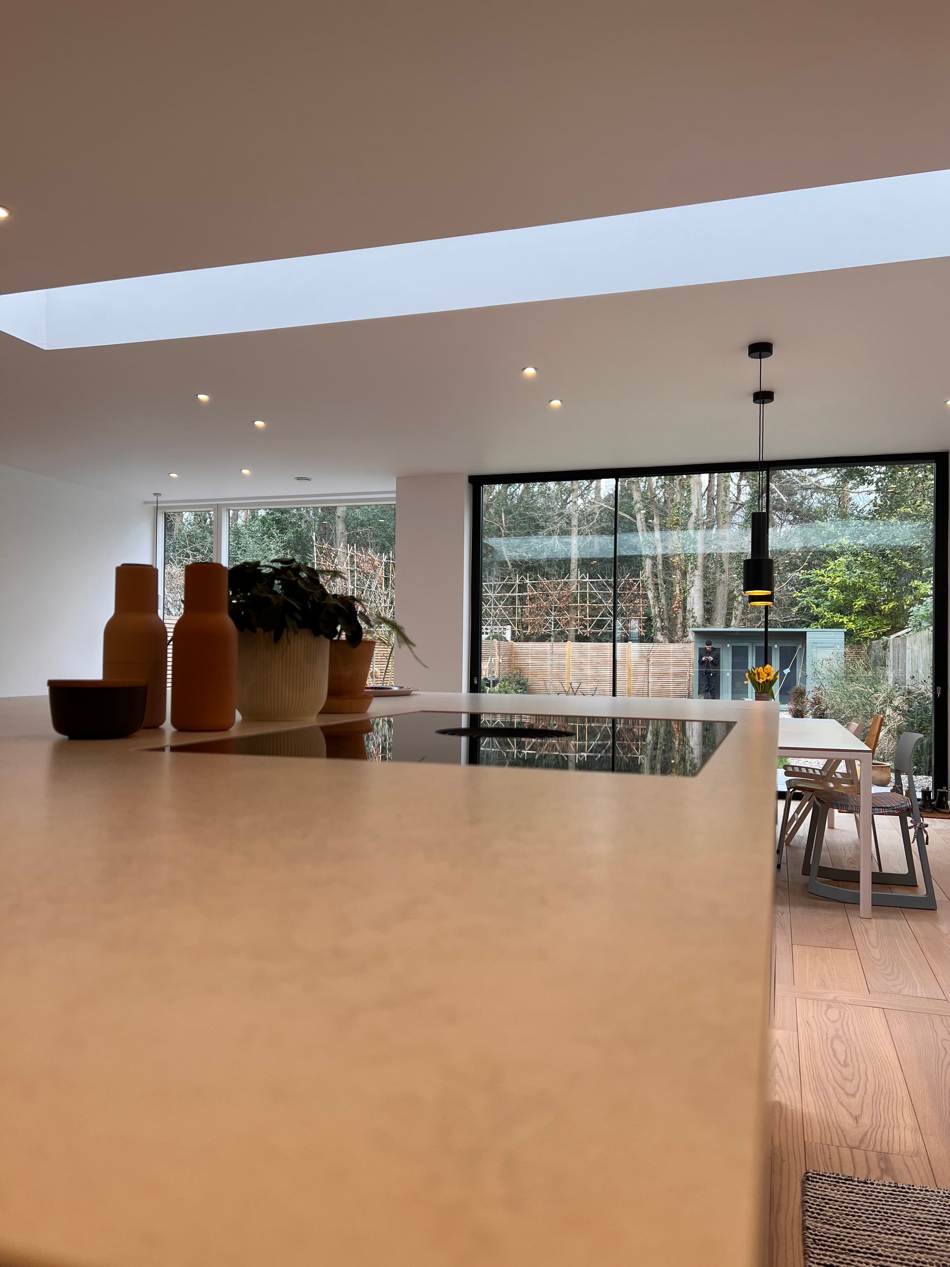Sage green kitchen island with quartz worktop