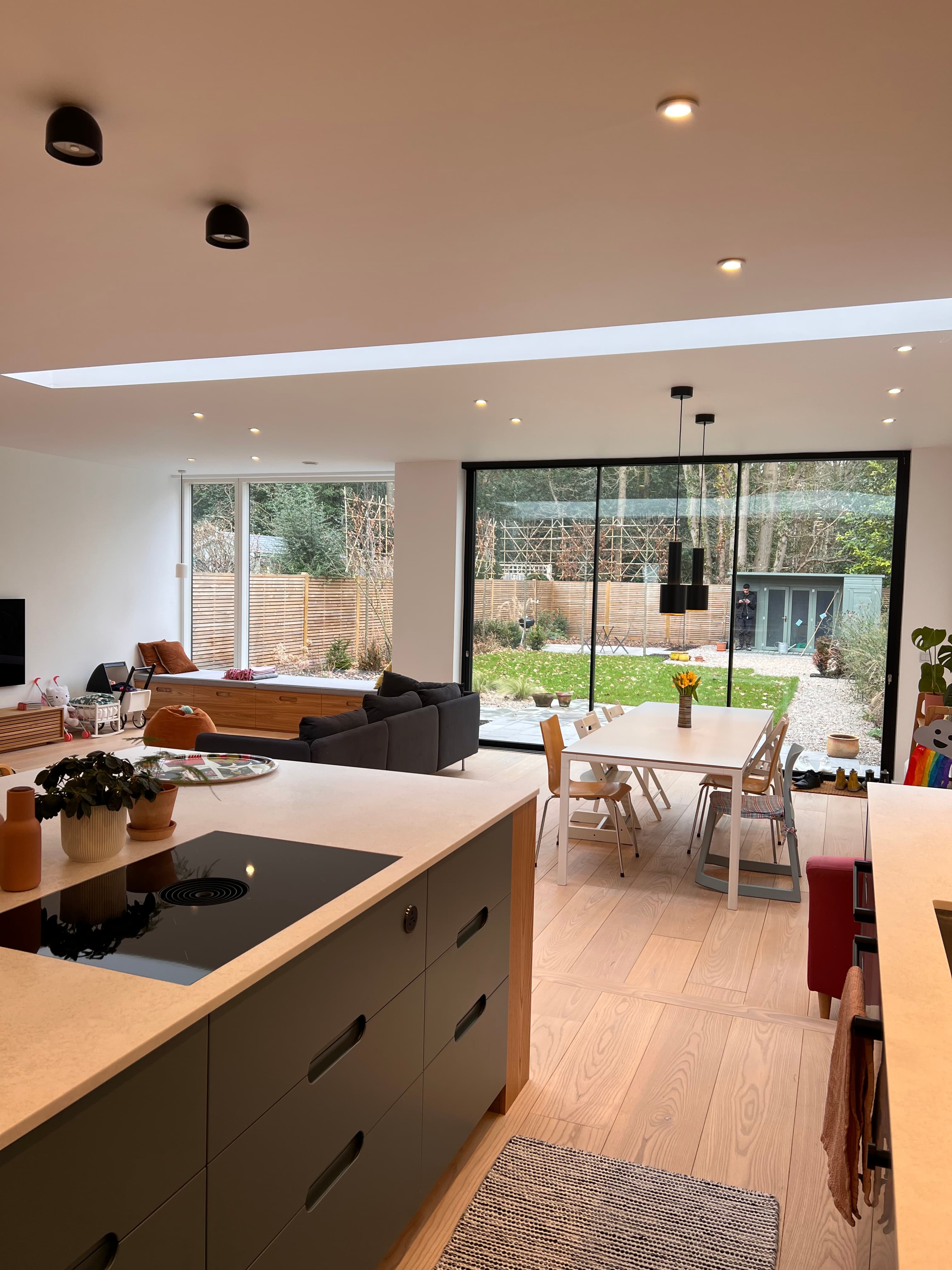 Open-plan living with skylight and floor-to-ceiling glazing